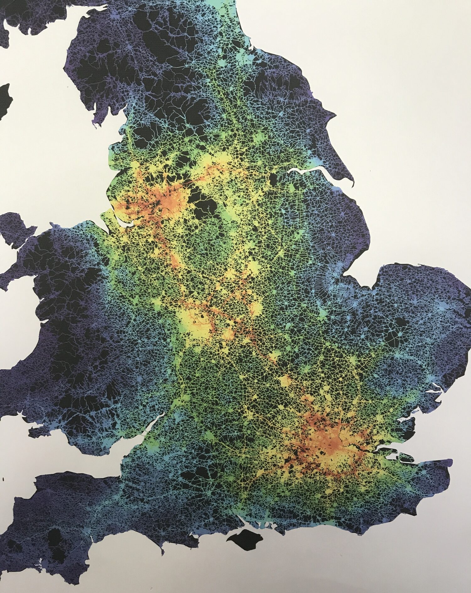 The same connectivity analysis zoomed to England: the Peak District sits as a dark void at the centre of a continuous ring of warm density — Manchester, Sheffield, Leeds, Derby, Nottingham, Stoke, Birmingham